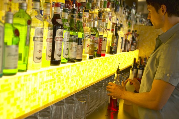 "Man working in bar, facing optics"