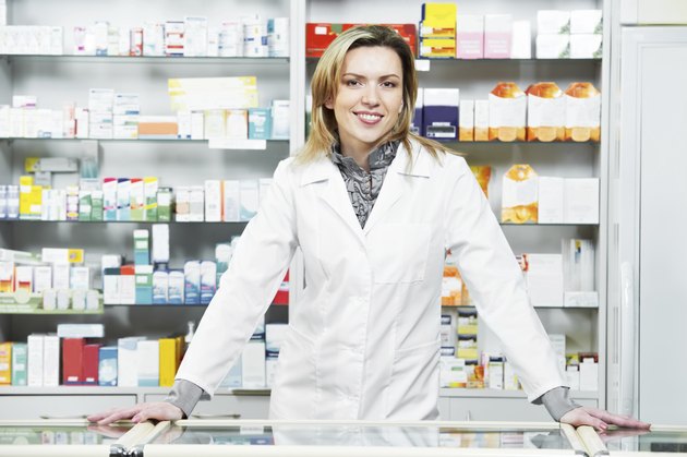 Pharmacy chemist woman in drugstore