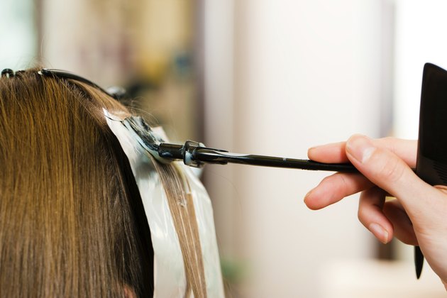 At the hairdresser ? woman gets new hair colour