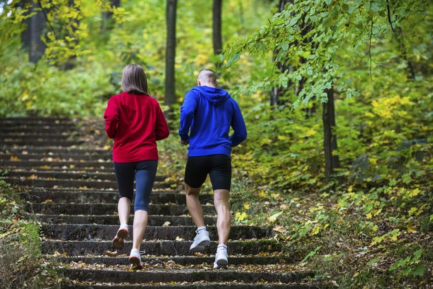 Woman and man jogging in park