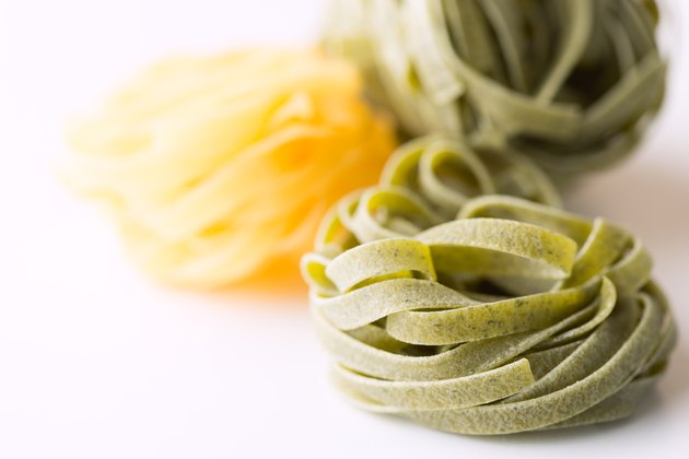 Dry pasta background on white