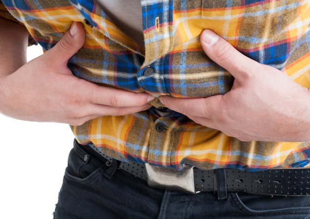 Close up of male with discomfort and stomach cramps