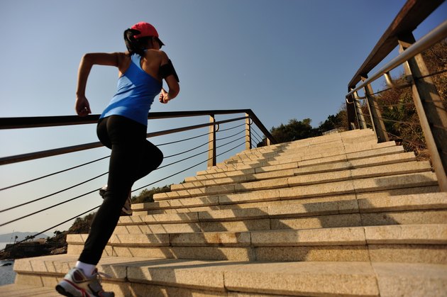 healthy lifestyle asian woman running at stairs seaside