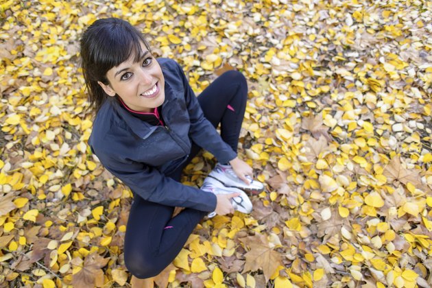 Cute sport girl stretching legs