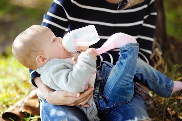 Baby drinking milk from bottle