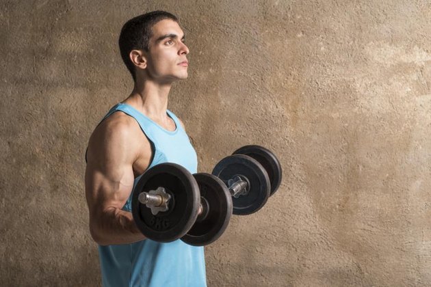 Arnold Press vs. Barbell Press | Livestrong.com