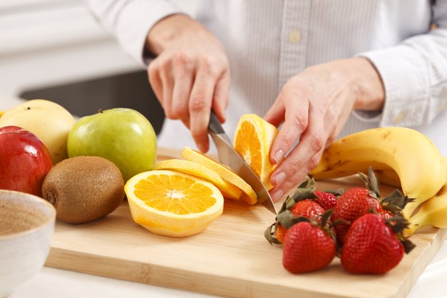 Woman slicing orange