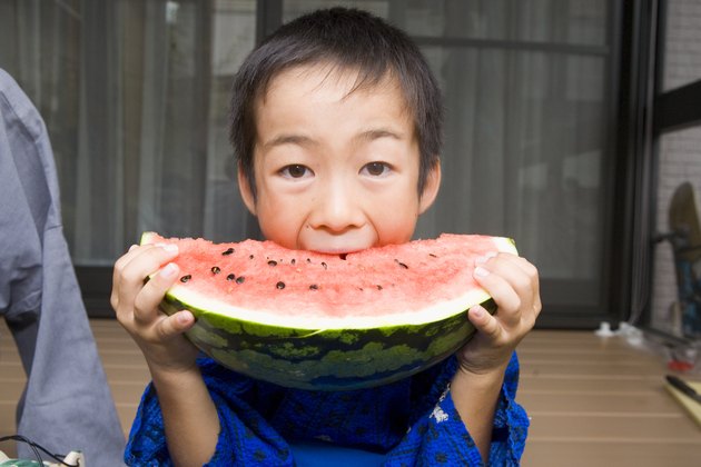 Boy Biting Watermelon