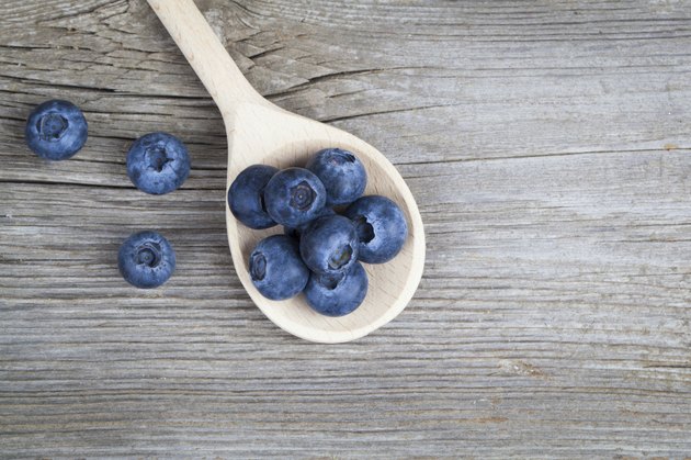 Blueberries on a wooden spoon