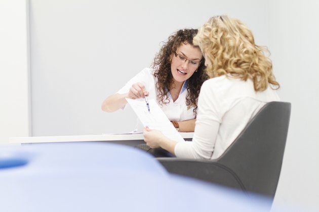 Female doctor discussing patient test results