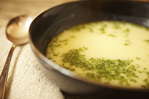Chicken bone broth soup with fresh herbs