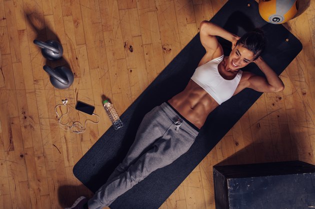 Smiling female working out at the gym