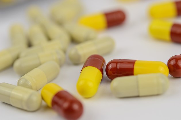 Yellow and red capsules isolated