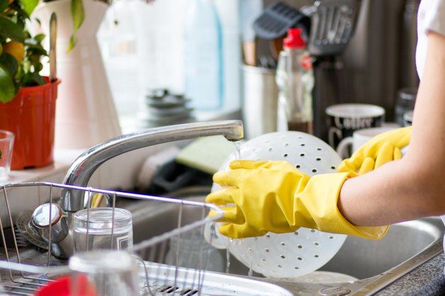 woman washing dishes in the kitchen