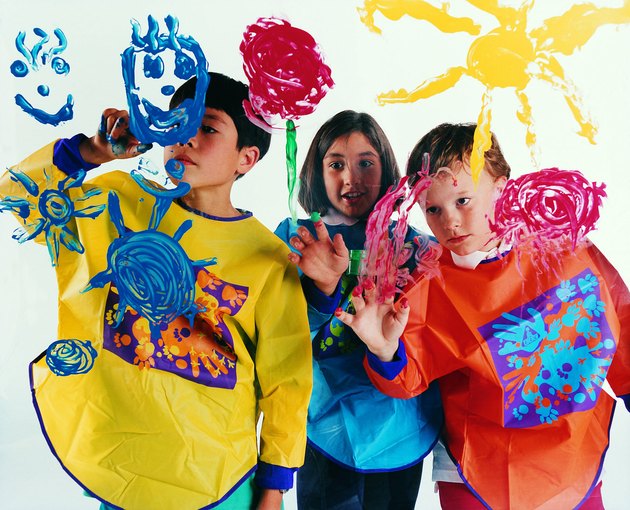 Children painting on glass