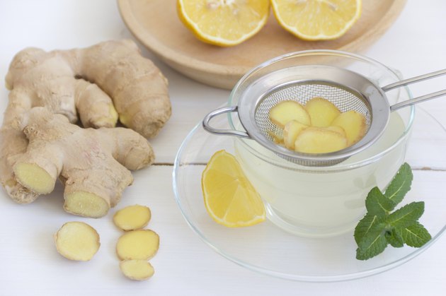 Ginger tea with lemon and mint in tea cup