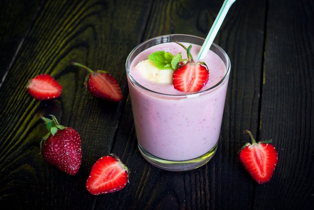 Glass of smoothie with strawberries
