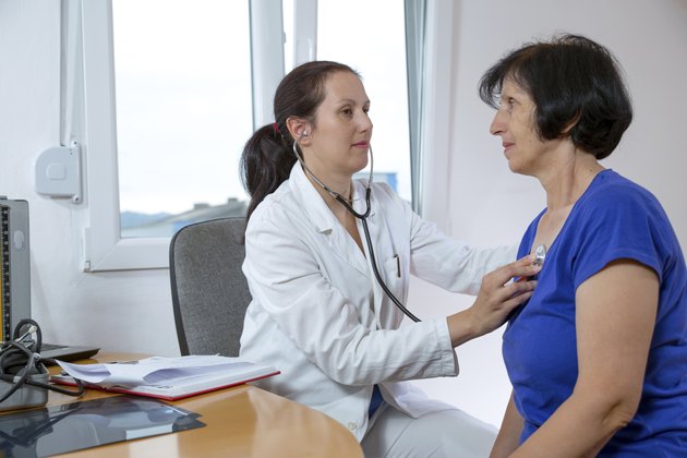 Female doctor examining her patient