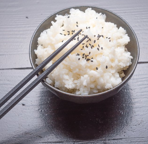 cooked rice with black sesame on bowl