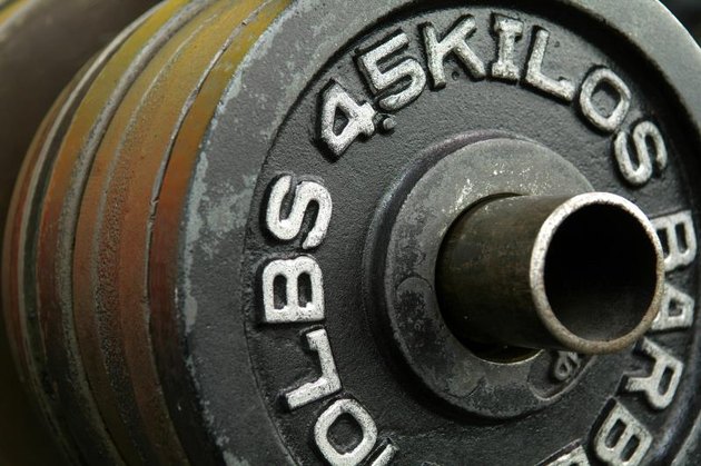 4.5-kilo weight plates on a rack.