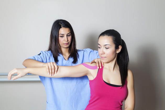 Patient at physiotherapy with tapes