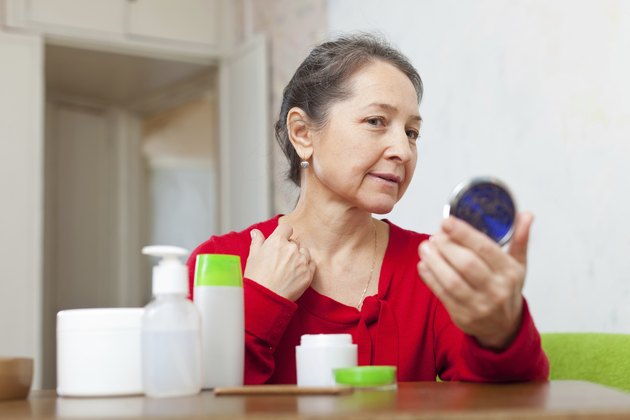 Mature woman stares on neck