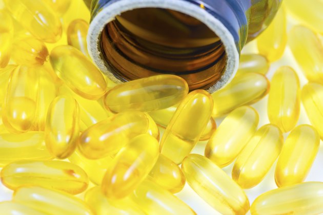 Fish oil pills spilled from container
