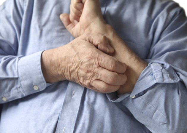 businessman with an itchy arm