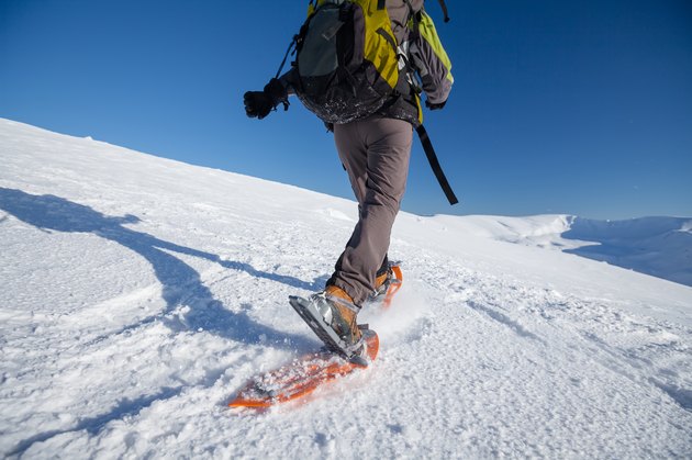 Snowshoeing in Carpathian mountains in wintertime