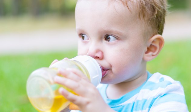 Little boy drinking his beverage
