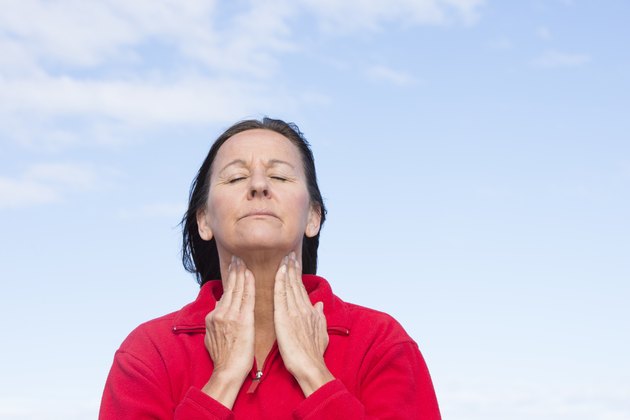 Woman with painful throat ache