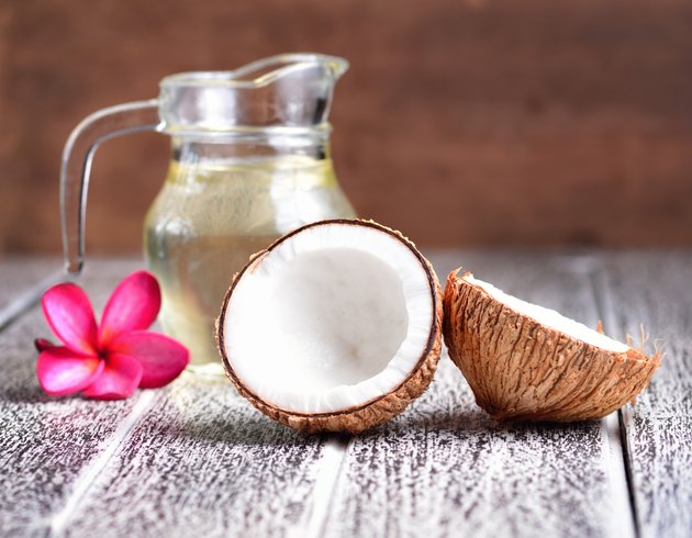 coconut oil isolated on wooden background.