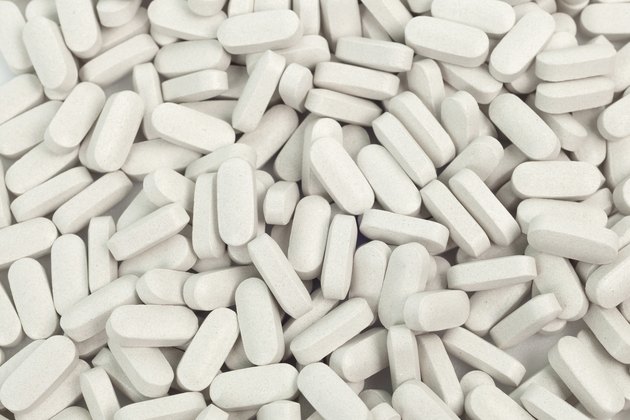 Group of medicine pills on white background