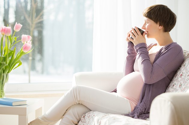 Pregnant woman drinking tea