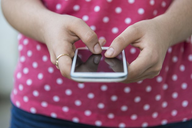 Teenage girl using mobile smart phone