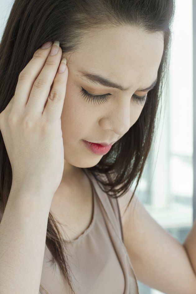 woman with headache, migraine, stress, hangover, mental problem