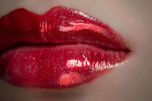 The red plump lip belongs to a Asia girl.