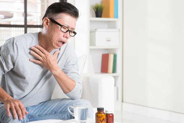 Mature Asian man cough