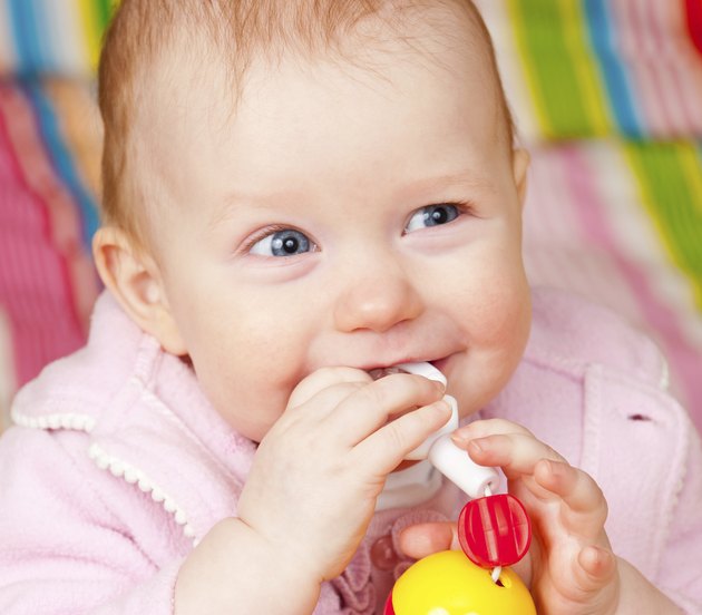 Infant with teething toy