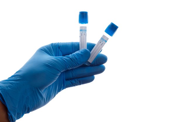 Hand with a test tube