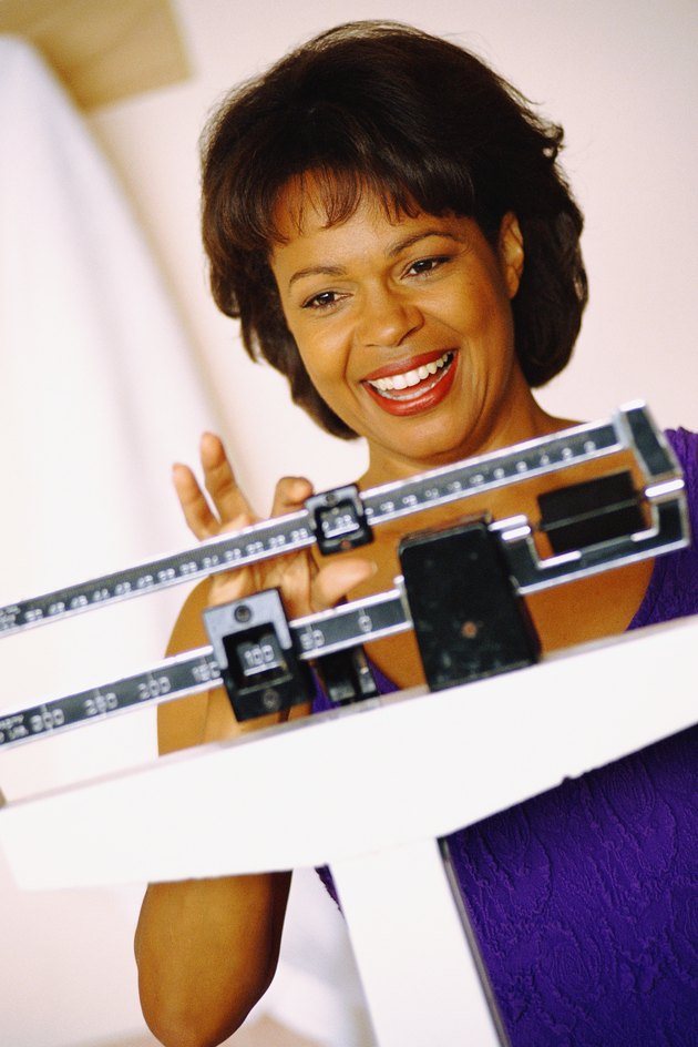 Woman balancing scale