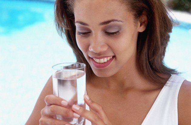 Woman holding a glass of water