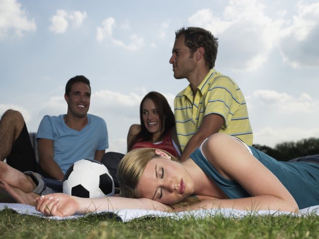 Young people resting in a field