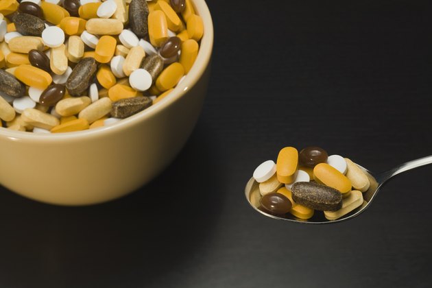 Bowl and spoonful of pills