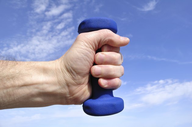 Hands Holding Blue Weight