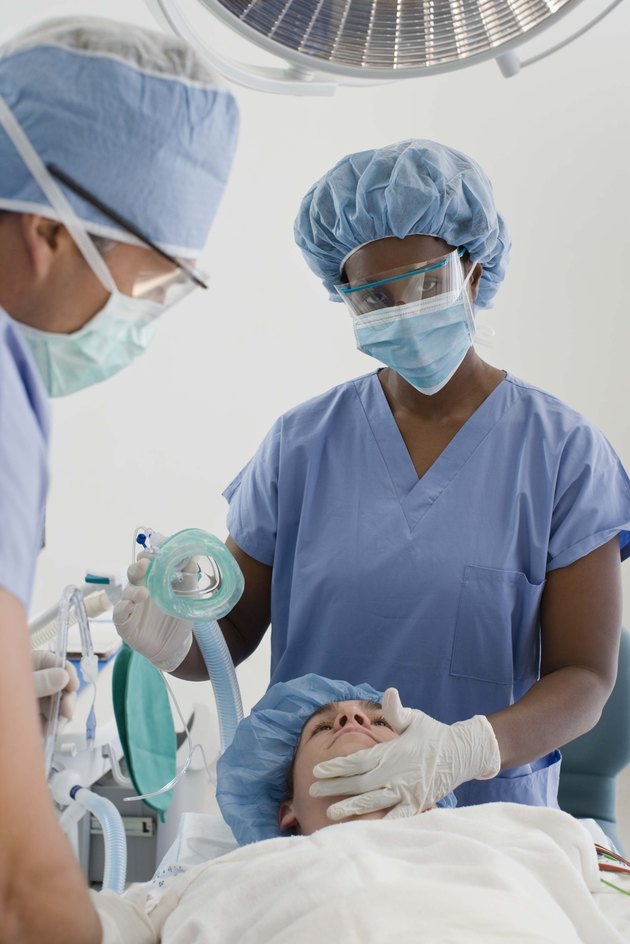 Doctors with patient in hospital