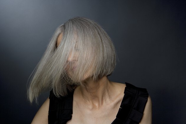 Mature woman turning head, close-up