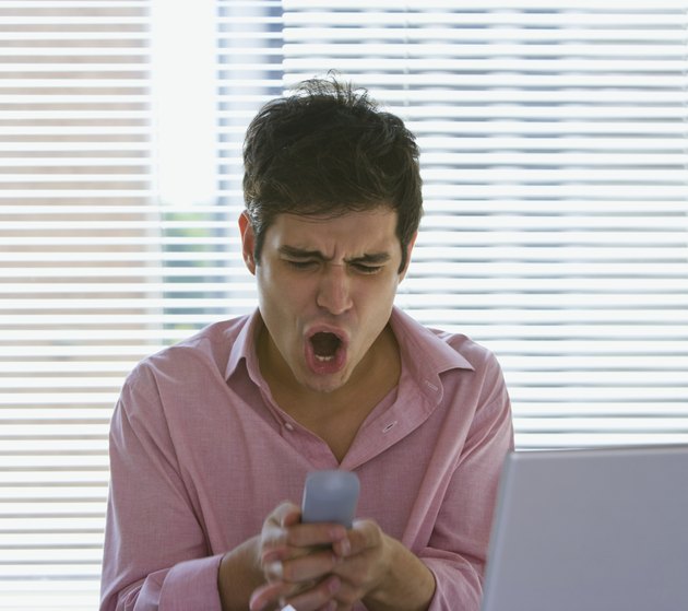 Man screaming at cell phone