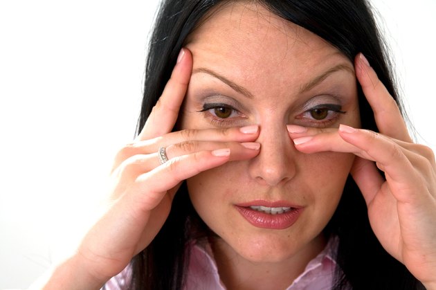 Head shot of woman with sinus pain