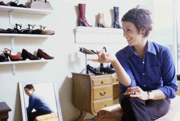 Young woman sitting in a shoe store